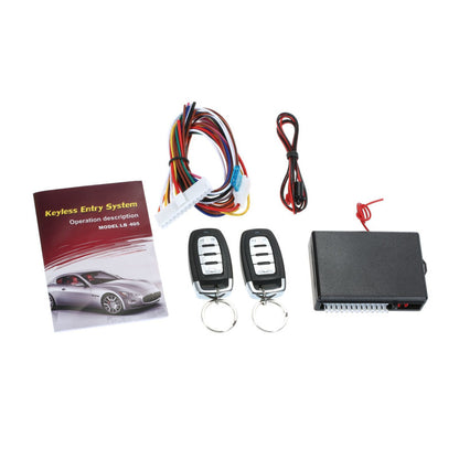 Kit verrouillage centralisé modèle E comprend 1 boite commande 2 télécommandes 1 jeu fils 1 indicateur LED 1 manuel d'utilisation